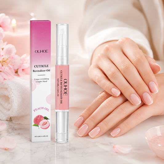 Healthy, natural-looking nails beside the Cuticle Revitalizing Oil pen and box
